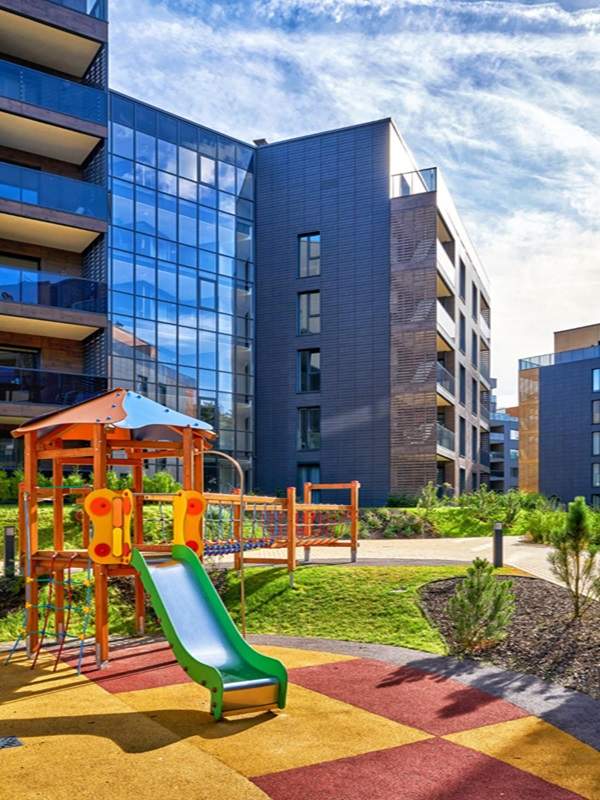 Modern Apartment Complex with Children's Playground